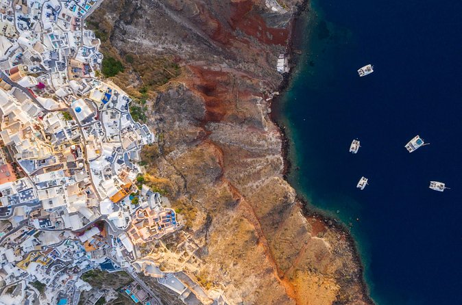 Experience Santorini Sunset by Helicopter - Akrotiri From the Air: Archaeology Meets Red Cliffs