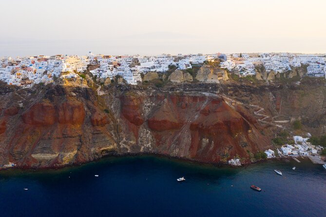 Experience Santorini Sunset by Helicopter - Oia From Above: White Houses, Blue Domes, and Real Caldera Depth