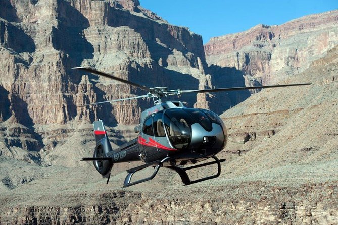 Grand Canyon Deluxe Helicopter Tour with Landing from Las Vegas - Touchdown at the private bluff: ramada shade and a champagne toast