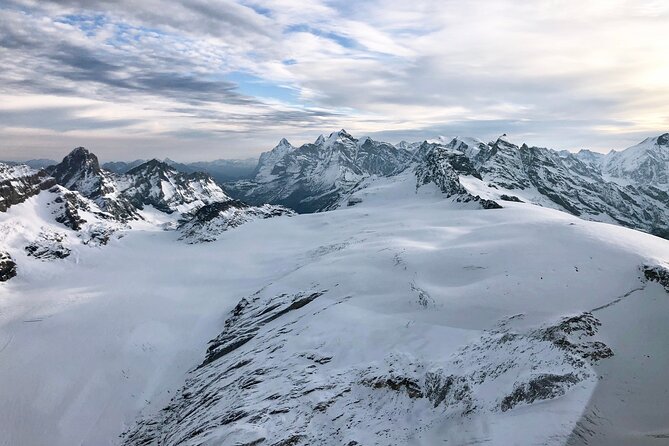 Matterhorn helicopter tour - longest scenic flight from Bern over the Swiss Alps - Lakes from above: Oeschinensee’s turquoise and Lake Thun’s glacier-water glow