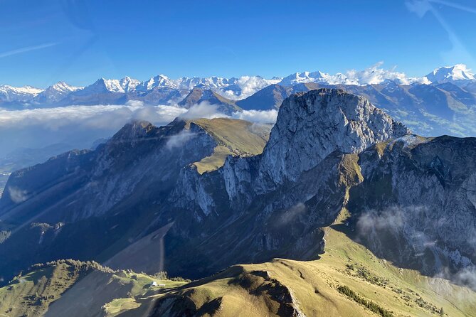Private helicopter flight to Stockhorn mountain, with view to the Swiss Alps - Niesen mountain: the pyramid shape and the triangular shadow idea