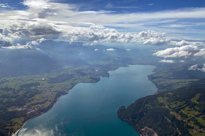 Private helicopter flight to Stockhorn mountain, with view to the Swiss Alps - Emmental from the air: cheese meadows and Langnau’s hockey stadium