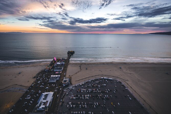 Private Helicopter Tour of Hollywood Sign, Beaches and More - Santa Monica Pier to UCLA: the coast, then the city’s schooling vibe