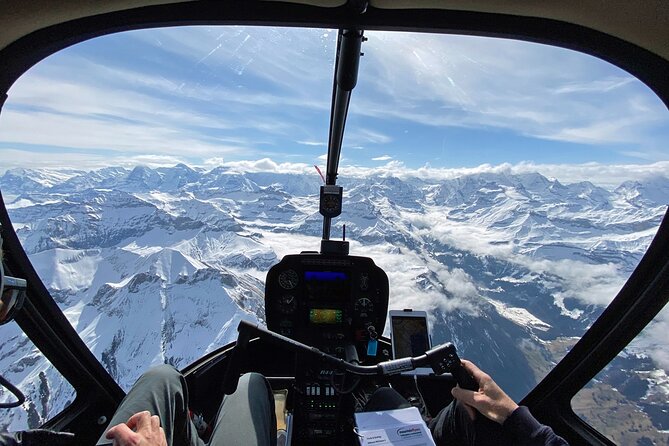 Private Swiss Alps helicopter tour over snow covered mountain peaks and glaciers - Schilthorn and Bond country: flying past film history without the crowds