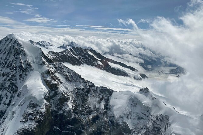 Private Swiss Alps helicopter tour over snow covered mountain peaks and glaciers - Eiger north face: a snow-covered cliff you can almost measure