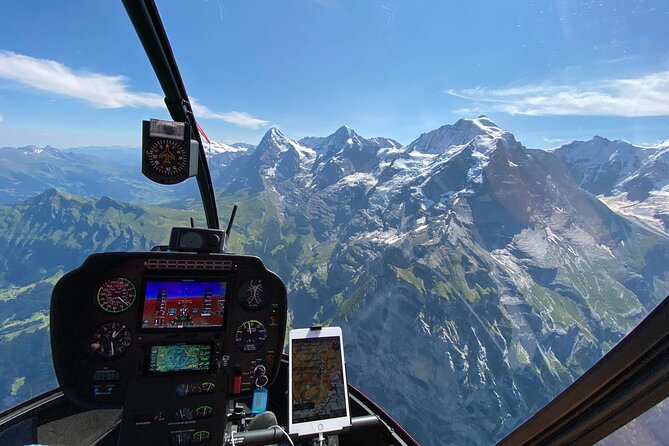 Private Swiss Alps helicopter tour over snow covered mountain peaks and glaciers - Interlaken from above: two lakes, one town, and glacier-fed color